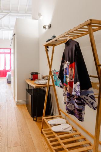 a room with a bunk bed and a desk at Danae Hotel in Nafplio