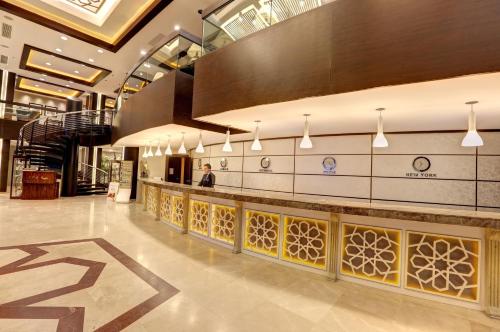 a lobby of a building with a person standing in it at Suhan Cappadocia Hotel & Spa in Avanos