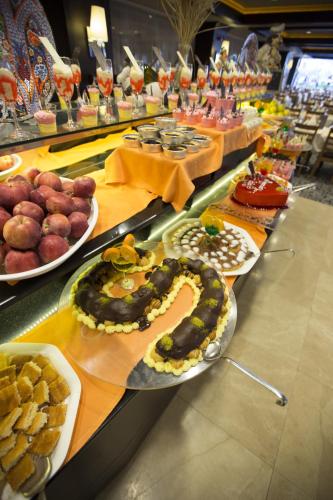 a buffet line with many different types of food at Suhan Cappadocia Hotel & Spa in Avanos