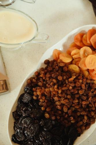 a bowl of nuts and raisins on a table at Skif HOTEL & SPA in Petropavlovsk
