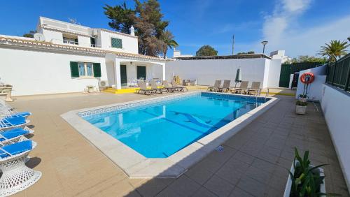 a swimming pool in front of a house at Villa Bea by Sunny Deluxe in Albufeira