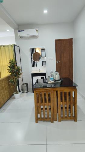 a living room with a counter and a table at Wayanad Palace in Ambalavayal