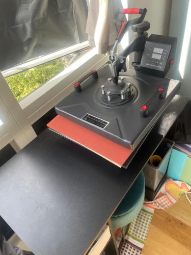 a sewing machine sitting on a table next to a window at Sunny 1bedroom flat for rent. in London