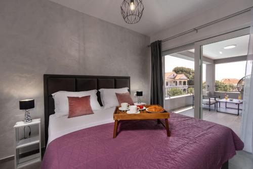 a bedroom with a large bed with a table at Modern villa Danica with pool in Zadar in Bibinje