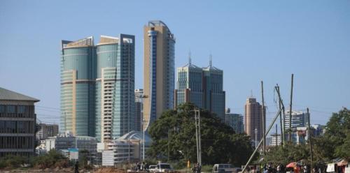 a city skyline with tall buildings in the background at Lovely Pearl lulu Intercity Homes in Dar es Salaam