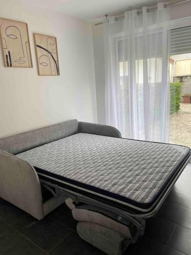 a mattress sitting on top of a bed in a room at Studio tout confort, au pied de toute commodité, 2 in Créteil