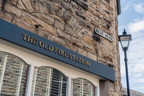 an old fire station sign on the side of a building at The Old Fire Station: Heart of Kirkby Lonsdale in Kirkby Lonsdale