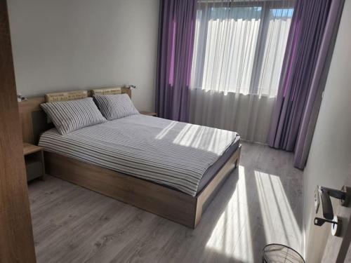 Postel nebo postele na pokoji v ubytování Harmony apartment