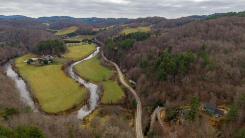 an aerial view of a river and a road at River View Retreat in Boone