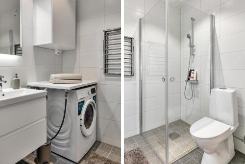 y baño blanco con aseo y lavadora. en Cosy Urban Home in Stockholm, en Estocolmo