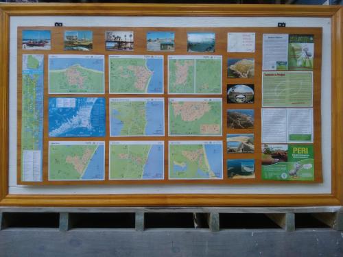 a bulletin board with a map on it at Posada IRSIS in La Pedrera