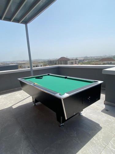 a pool table sitting on top of a roof at Dazzle hotels and apartments in Abuja