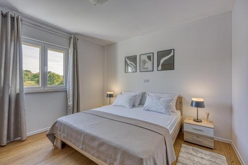 Ένα ή περισσότερα κρεβάτια σε δωμάτιο στο Villa Brijona