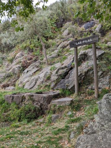a sign on the side of a rocky mountain at Apartamento Turístico Monteceli AT-CC-00748 in Gata