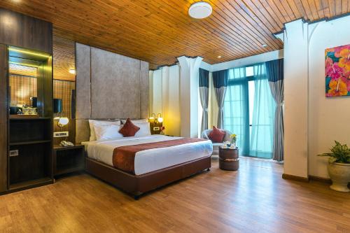 Postel nebo postele na pokoji v ubytování Udaan Nirvana Resort, Darjeeling
