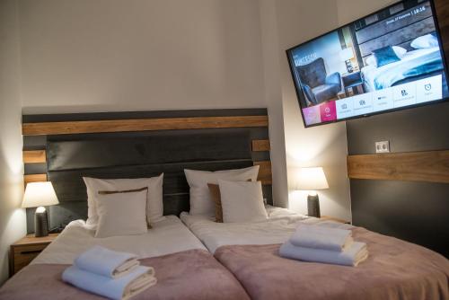 Postel nebo postele na pokoji v ubytování Hotel Sukcesor