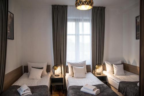 Postel nebo postele na pokoji v ubytování Hotel Sukcesor