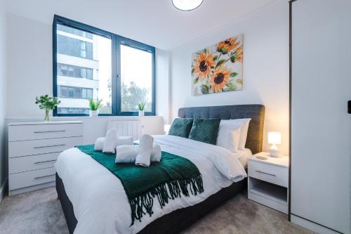 a bedroom with a large bed and a window at NEW! Stylish 2-bed apartment in Manchester by 53 Degrees Property - Amazing location, Ideal for Small Groups - Sleeps 4! in Manchester