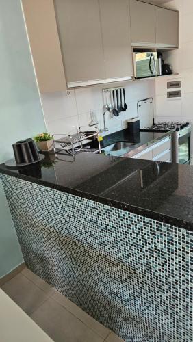 Kuchyň nebo kuchyňský kout v ubytování Cantinho do Atalaia à 650 metros da praia - Seu conforto fora de casa