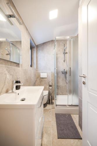 a bathroom with a sink and a shower at Luxury Villa Marko in Vir