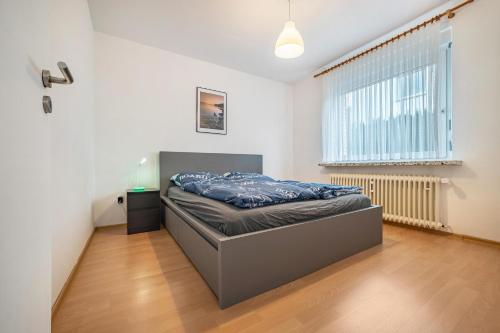 a bedroom with a bed in the middle of a room at Ferienwohnung Große in Osterode