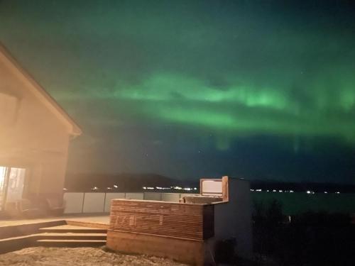 an image of the northern lights in the sky at New Aurora Hotspot - Studio Nordspissen in Tromsø