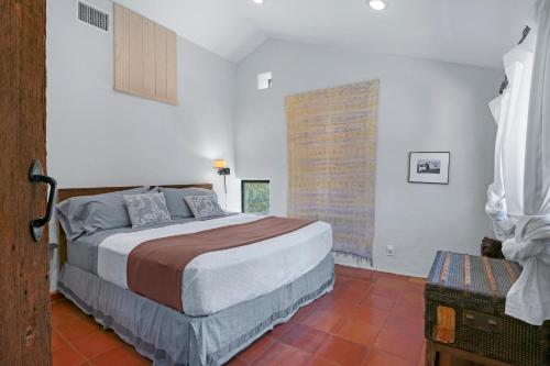 Ένα ή περισσότερα κρεβάτια σε δωμάτιο στο Camino Ranchito - Casa Sasa