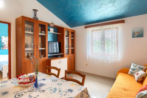 a living room with a table and a couch at Villa Greis with 4 bedrooms and pool in Buje in Momjan