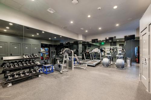a gym with several treadmills and machines in it at The Bonaparte in New Orleans