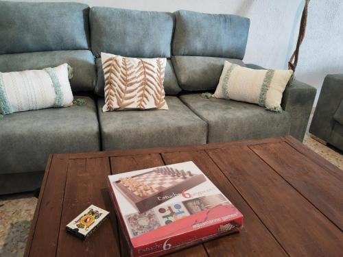 a living room with a couch and a coffee table at Casa Rural Teralba 2 in La Calzada de Oropesa