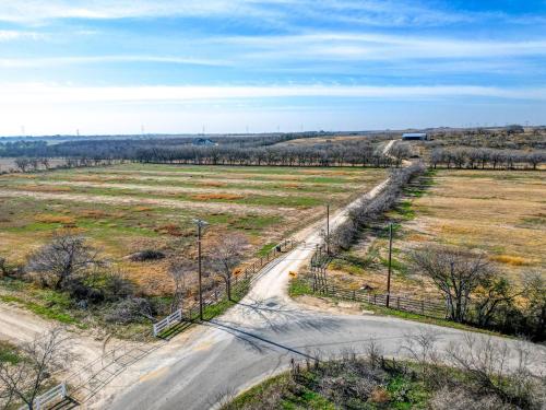 an empty road in the middle of a field at Coyote Creek Ranch in Martindale