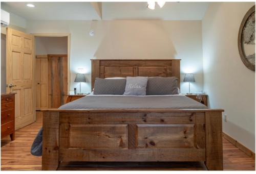 a bedroom with a large wooden bed in a room at Mockingbird Mountain Spa and Retreat in Luray