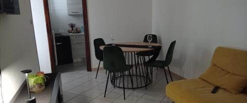 a small kitchen with a table and chairs in a room at RUDIAE Palace In Lecce in Lecce