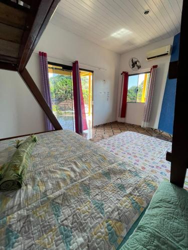 Katil atau katil-katil dalam bilik di Pousada Sossego de Alter