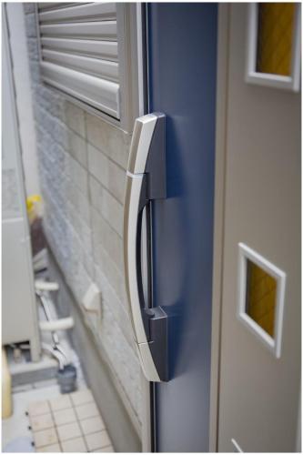 a close up of a door with a handle at TOKYO 幸町 Share House in Tokyo