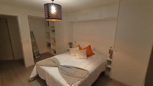 Postel nebo postele na pokoji v ubytování Ninho do Sonho
