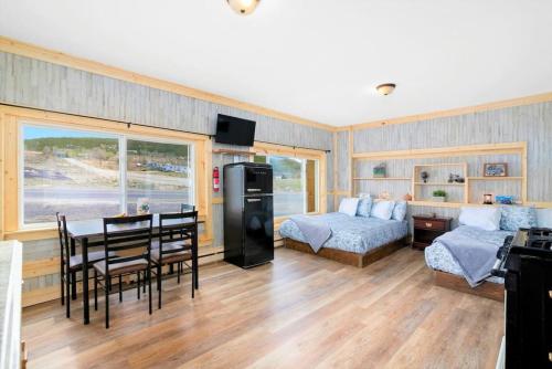 a living room with a bed and a dining room at 12Private Room with Kitchen Dog Friendly Leadville in Leadville