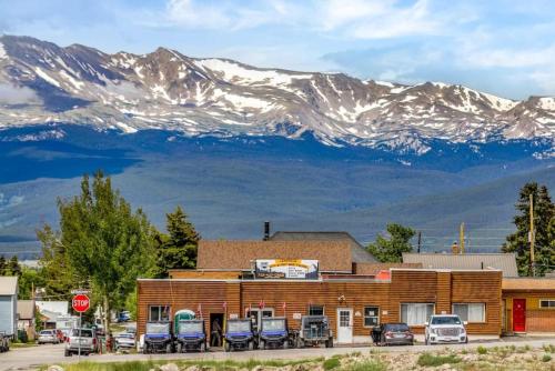 a building with parked cars in front of a mountain at 8 Private room in heart of Leadville dog friendly in Leadville