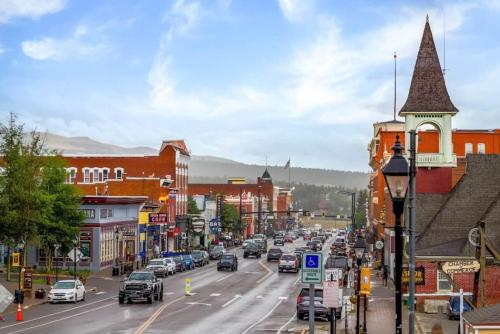 a busy street in a small town with cars on the road at 8 Private room in heart of Leadville dog friendly in Leadville