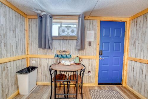 a room with a table and a blue door at 8 Private room in heart of Leadville dog friendly in Leadville
