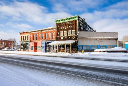 a building on a street with snow on the ground at 1 Spacious Private Room Dog Friendly Leadville in Leadville
