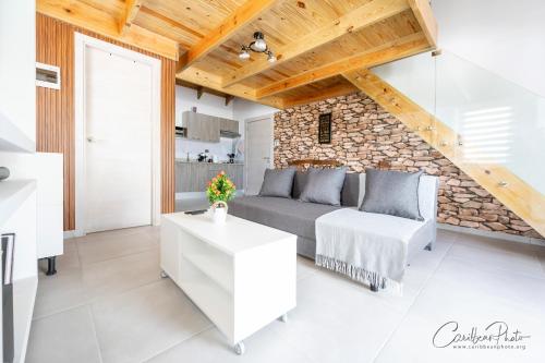 a living room with a couch and a table at Paradise Dream Dominicus in La Laguna