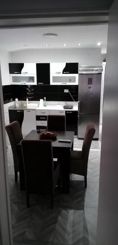 a dining room with a table and chairs at YOUR home in Belgrade