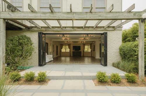 an entrance to a building with a wooden pergola at Sole East Resort in Montauk
