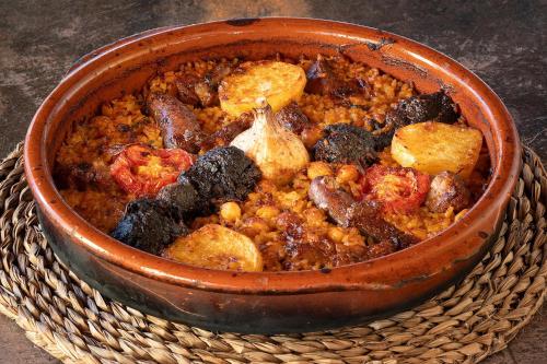 a bowl of food sitting in a basket at Hotel Alahuar in Benimaurell