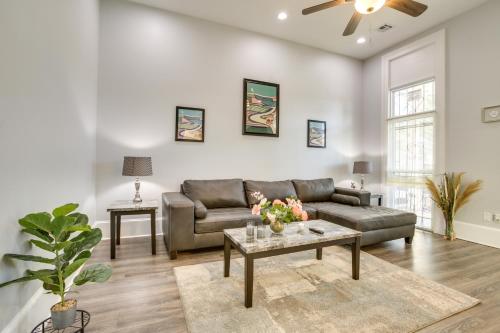 a living room with a couch and a table at 2 Mi to French Quarter Walkable NOLA Home in New Orleans