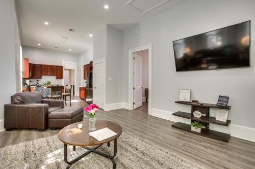 a living room with a couch and a table at 2 Mi to French Quarter Walkable NOLA Home in New Orleans