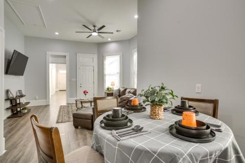 a living room with a table and a couch at 2 Mi to French Quarter Walkable NOLA Home in New Orleans