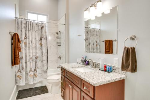 a bathroom with a sink and a shower and a toilet at 2 Mi to French Quarter Walkable NOLA Home in New Orleans