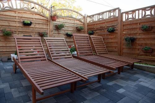 a group of chairs sitting on a patio at Sobe App Moj Hir bed and breakfast in Jastrebarsko